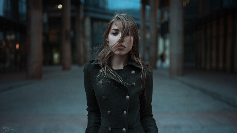 depth of field, teenager, hairstyle, brunette, street, hair, architecture, city, one person, portrait, coats, 1080P, muted, looking at viewer, windy, women outdoors