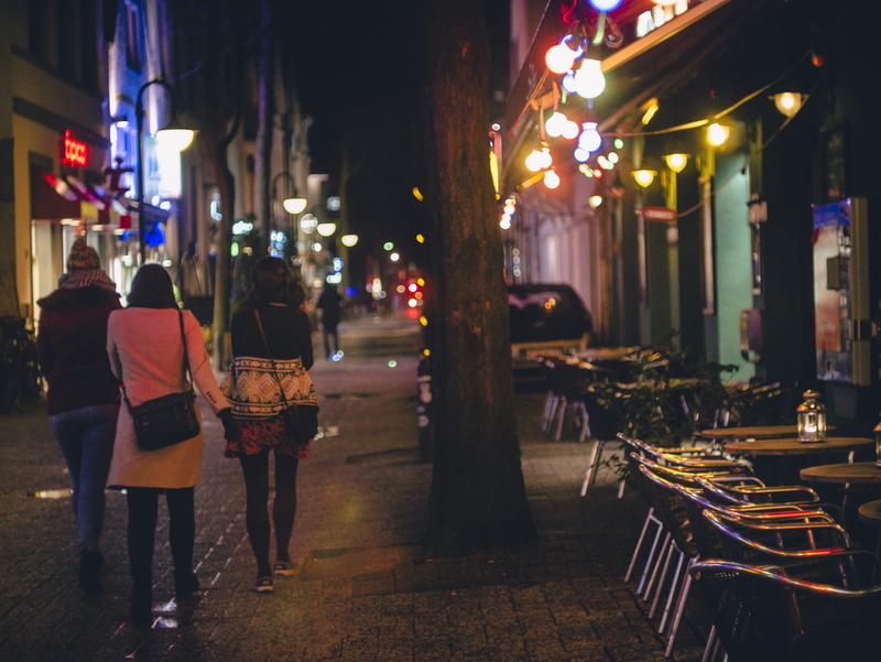 tourist, chairs, commerce, city, string lights, bars, lifestyles, adult, women, leisure activity, business, tourism, urban, building exterior, dark, friends