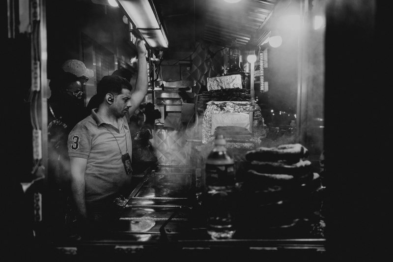 women, vendor, preparation, new york city, waist up, food, dark, street cart, refreshment, two people, holding, drink, street food, city, man, occupation