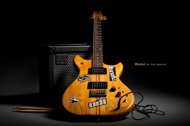 arts culture and entertainment, musical instrument, aggression, background, music, rock music, bass guitar, guitar, indoors, cable, wood - material, black background