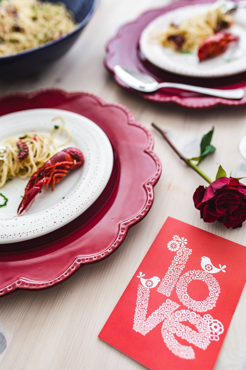 indoors, food and drink, octopus, napkin, baked, freshness, high angle view, elegant, red, seafood, crockery, dinner, plant, flower, close-up, food, celebration
