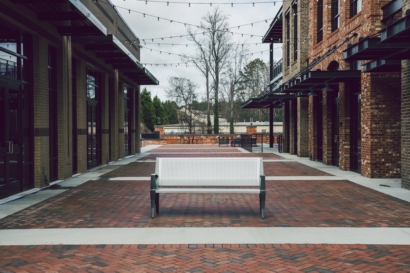 white, tabletop, building, seat, city, patio, sugar hill city hall, pergola, dining table, brick, building exterior, floor, georgia, absence, nature, bench