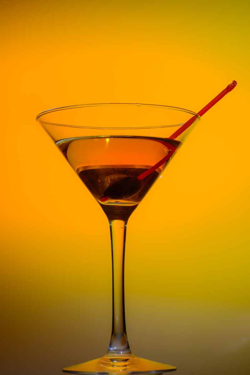 glass - material, close-up, indoors, manhattan, half, yellow, food and drink, red, still life, studio shot, drinking glass, martini glass, martini, alcoholic