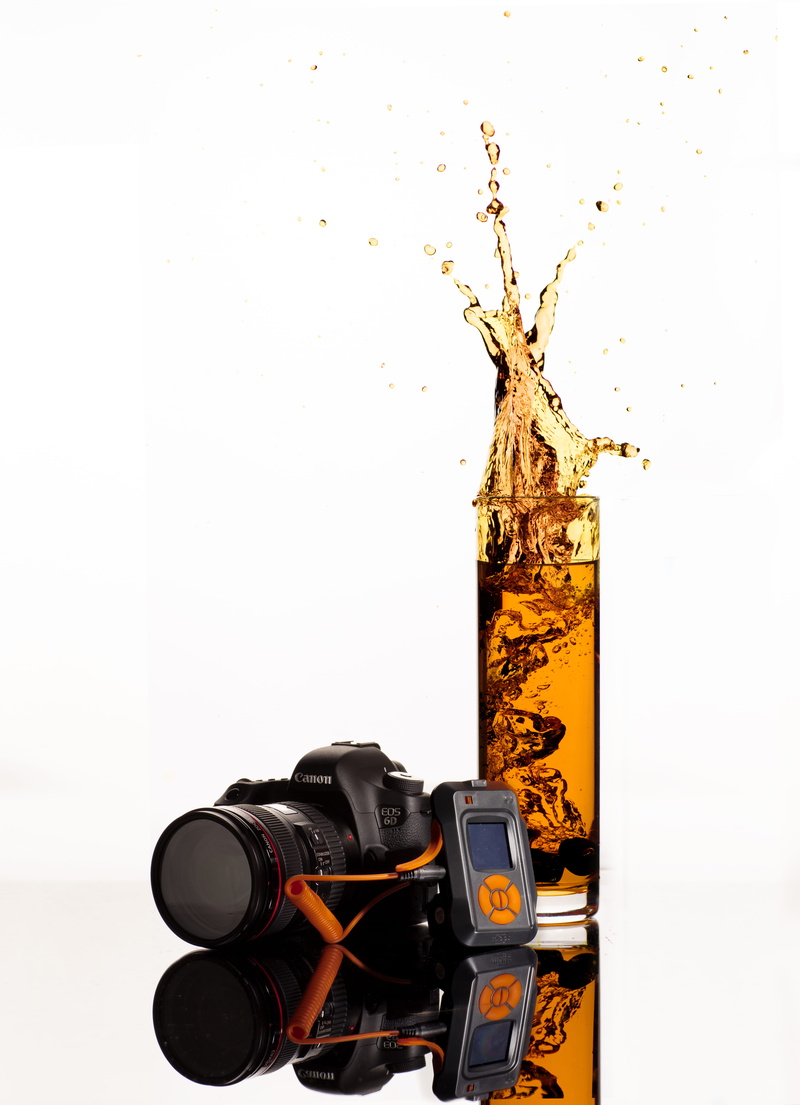 digital camera, no people, long-exposure, drink, splash, black, modern, indoors, clear, communication, close-up, highball, behind, wall - building feature