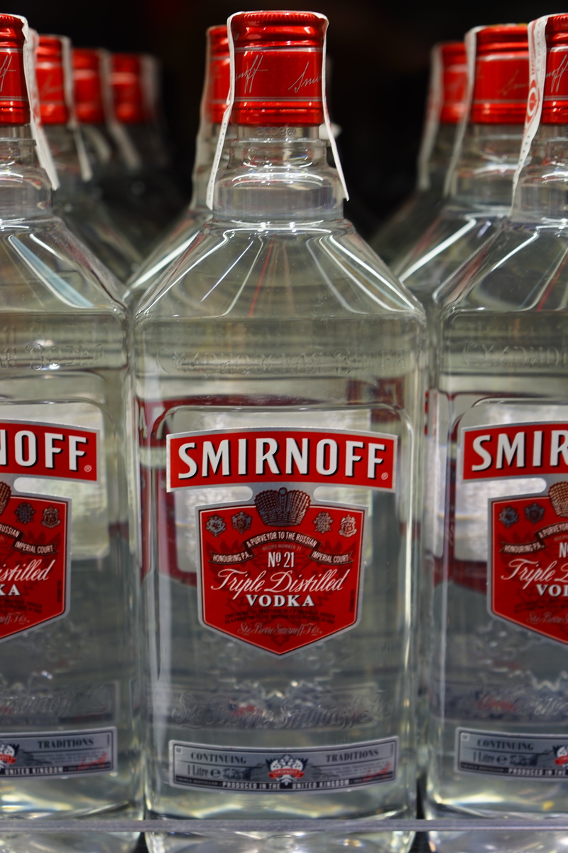 surface, lot, vodka, shop, text, indoors, 5K, diageo, information sign, close-up, glass - material, smirnoff, container, drink, healthcare and medicine