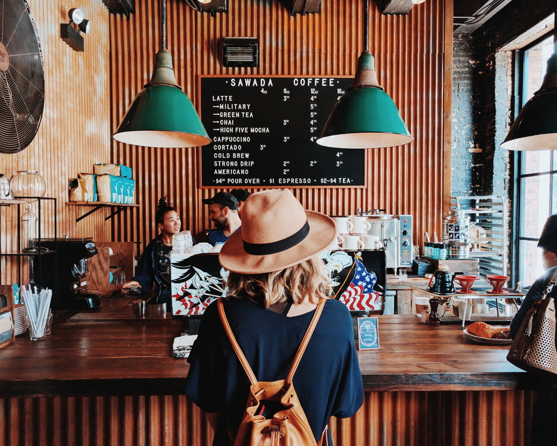 customers, adult, glass, leisure activity, one person, hat, pattern, headshot, fashion, employees, menu board, incidental people, 2K, indoors, rear view