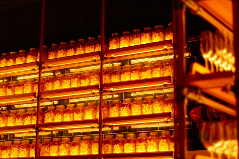 candy, retail, shelf, arrangement, lot, order, banister, container, glow, architecture, shop, red, food and drink, store, silhouette, illuminated, abundance