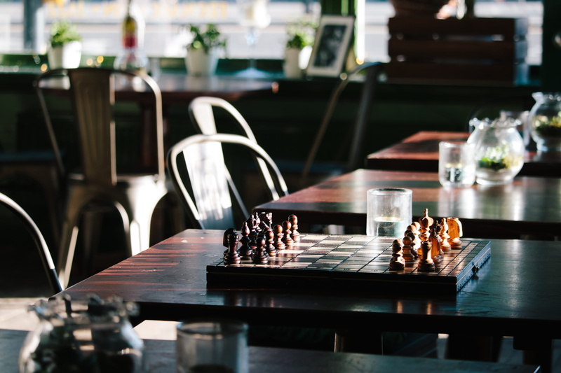 nature, arranged, black, still life, coffee shop, glass, seat, no people, business, cafe, tray, piece, chess, food, wooden, wood - material, day, indoors