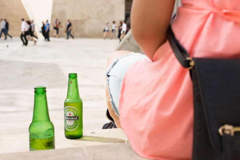 Heineken, drink, beer bottle, refreshment, focus on foreground, people, bottle, hands, one person, incidental people, alcohol, outdoors, beer, casual clothing