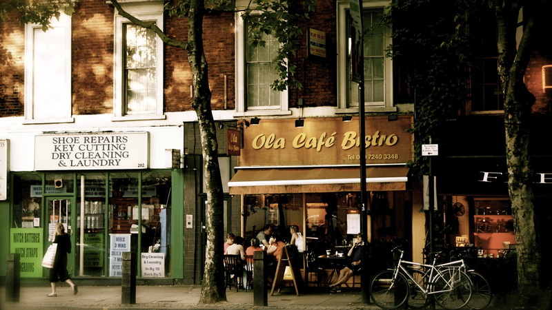 outdoors, 1080P, street, western script, black, men, information sign, urban, architecture, building, real people, people, street view, table, landscape