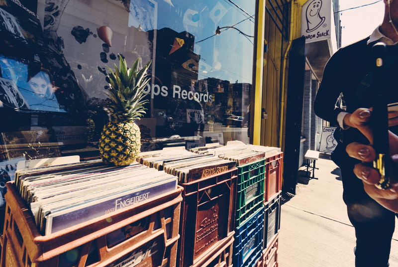 business, taking photo, outdoors, leisure activity, woman, commerce, wear, women, adult, day, iphone, pineapple, downtown, built structure, street, reflections