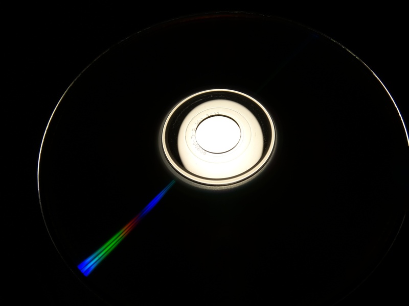 computer, geometric shape, light, lighting equipment, lichtspiel, directly below, shape, floppy disk, close-up, light fixture, indoors, illuminated, cd