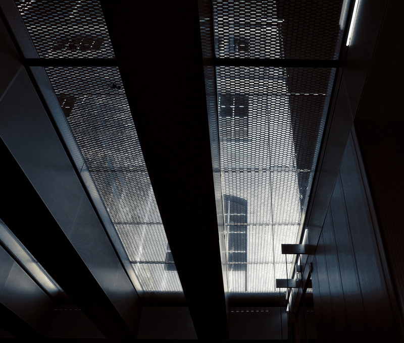no people, day, glass - material, transparent, staircase, window, light, roof, prada, office building exterior, construction, low angle view, modern, skyscraper