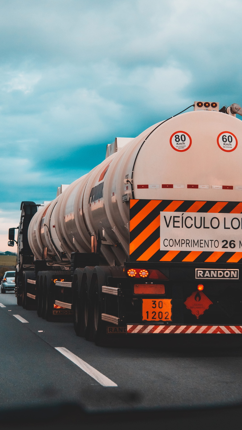 outdoors, business, oil, semi-truck, brazil, motor, trucking, freight transportation, tanker, land vehicle, motion, cloud - sky, trailer truck, train, locomotive