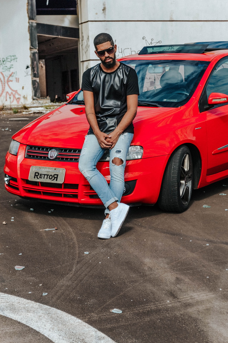 casual clothing, automobile, mode of transportation, front view, machine, portrait, leisure activity, young adult, young men, day, car wheel, hood, vehicle