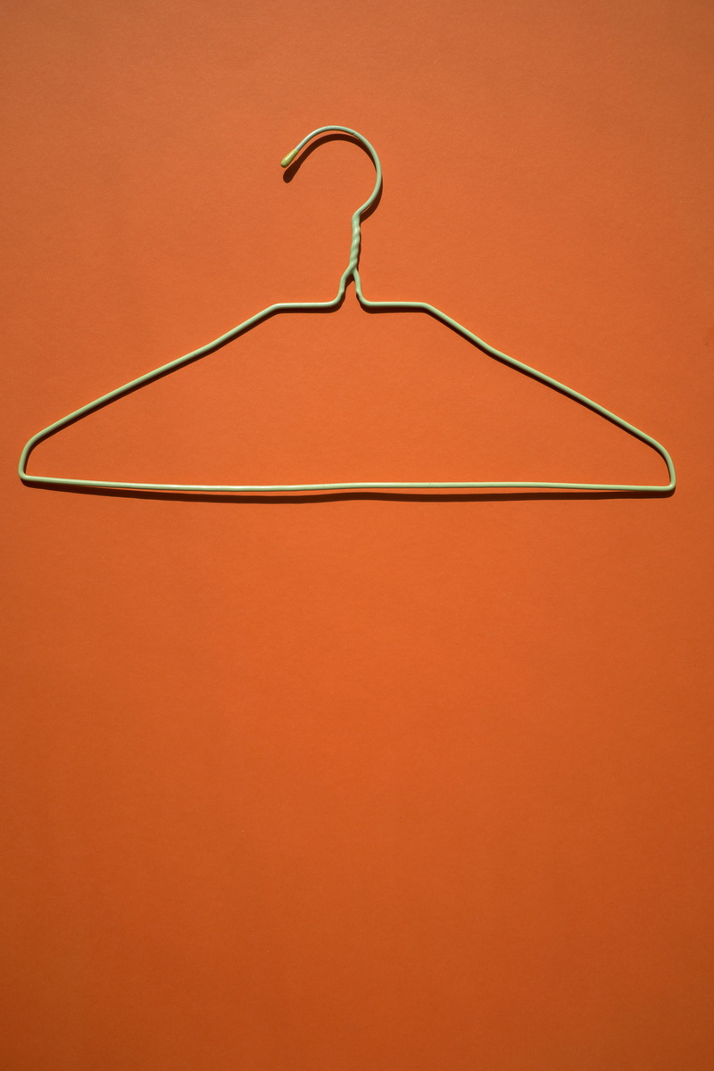 orange color, photo, coathanger, minimalism, orange, color, simplicity, clothes hanger, colour, indoors, closeup, copy space, white, close-up, empty, shoulder