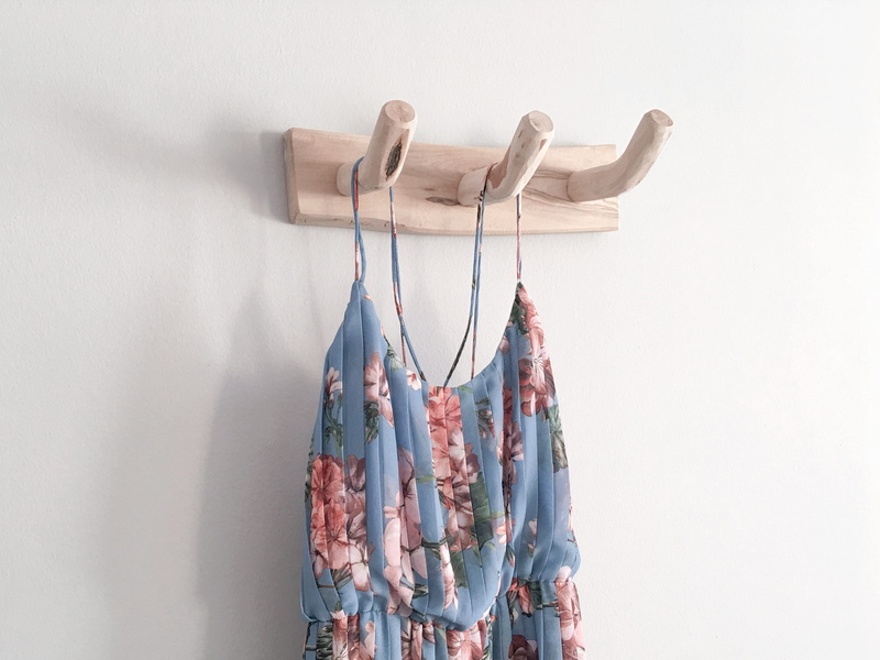 wall, floral pattern, hanging, textile, white color, white wall, floral, clothing, pattern, coat hook, white, flowers, flower, simplicity, no people, coat rack