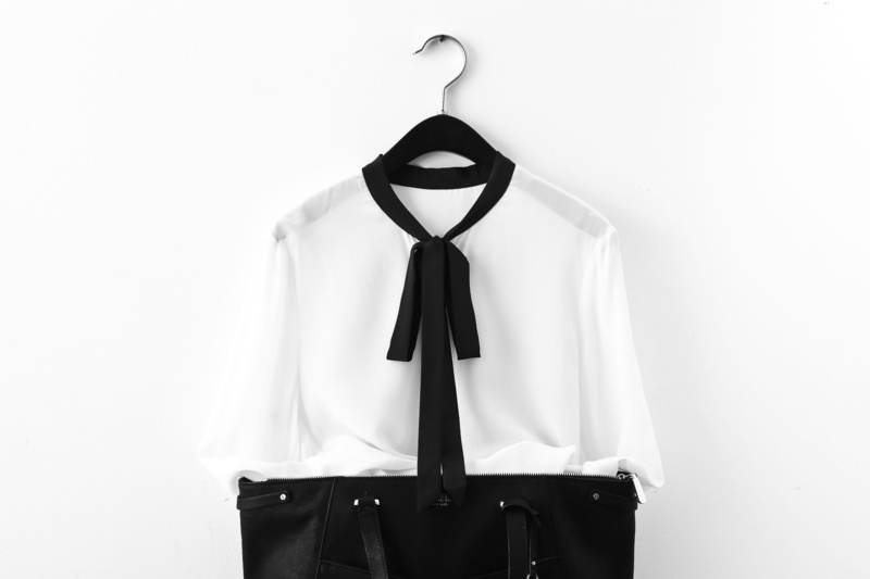 well-dressed, close-up, white background, button down shirt, hanging, necktie, studio shot, no people, bag, black and white, human representation, shirt