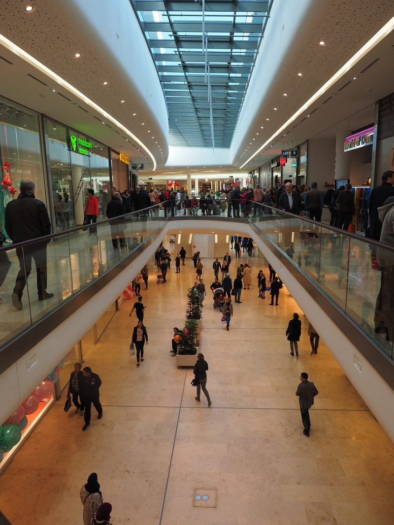 building, interior, lifestyles, adult, real people, retail stores, shopping mall, inside, multi-level, men, leisure activity, mall, passenger, illuminated