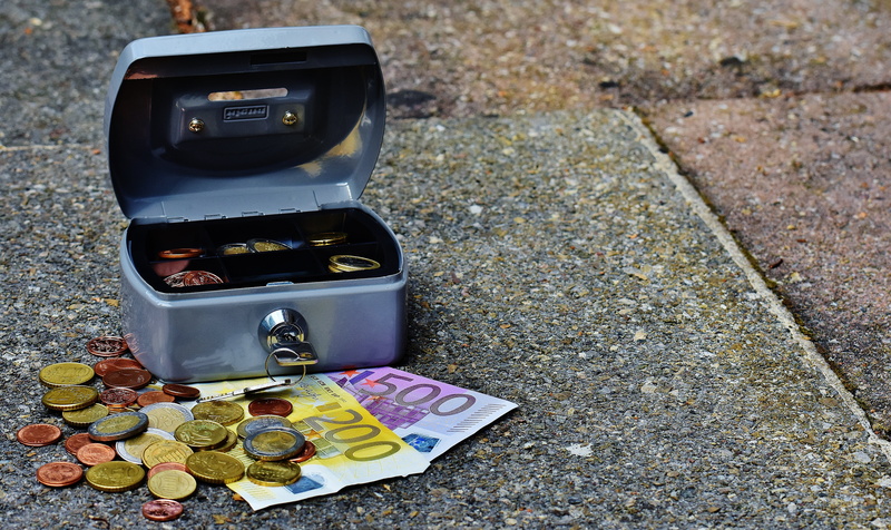 banknotes, sidewalk, surface, container, money box, coins, outdoors, coin, cashbox, cash and cash equivalents, no people, business, paper currency, money