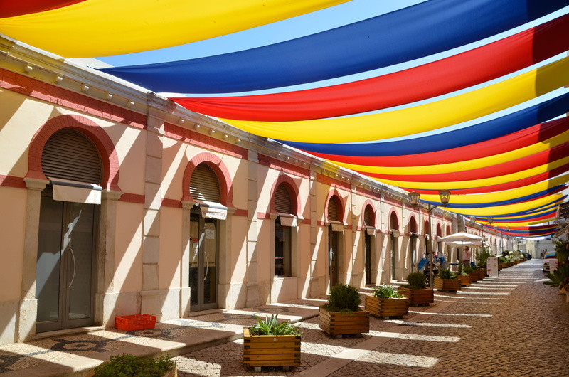 multi colored, no people, sun, travel destinations, shade, in a row, tourism, red, shadow, the way forward, architectural column, built structure, the past