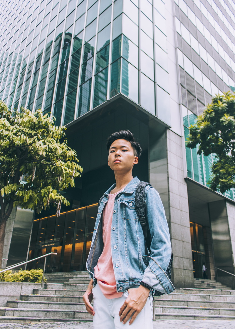 tree, flora, person, man, human, singapore, vine, casual clothing, building, reflection, young men, concrete, asian, looking away, standing, backpack, one person