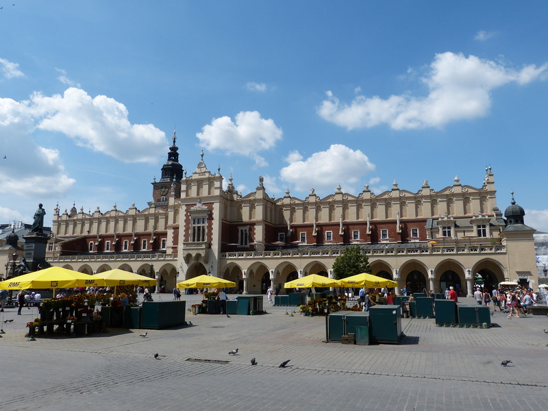 built structure, street, krakow, facade, black, parasol, marketplace, arch, cloth hall, brown, historic old town, tourism, space, cloud - sky, building exterior