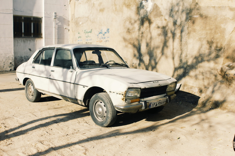 architecture, nature, sunlight, transportation, outdoors, building exterior, no people, land vehicle, shadow, street, city, white, rust, built structure