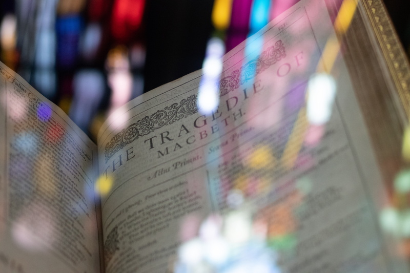 architecture, celebration, communication, light effect, showing, word, tragedie, western script, obscured view, focus on foreground, multi colored, 5K