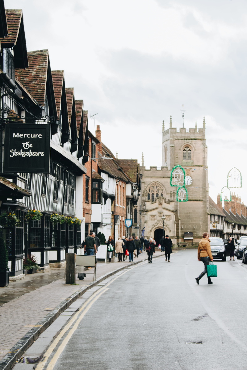 women, urban, building exterior, real people, town, outdoors, street, pedestrian, nature, tower, built structure, sign, walkway, stratford-upon-avon, architecture