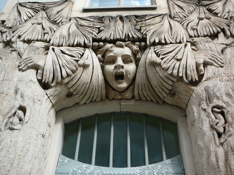 representation, creativity, doors, stucco ornaments, day, 1080P, mouth open, low angle view, wall - building feature, human representation, craft, ornate