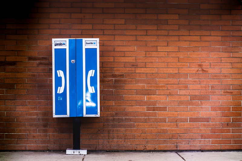 representation, outdoors, information, near, communication, text, payphone, western script, plant, building exterior, brick, shelf, sign, no people, scoreboard