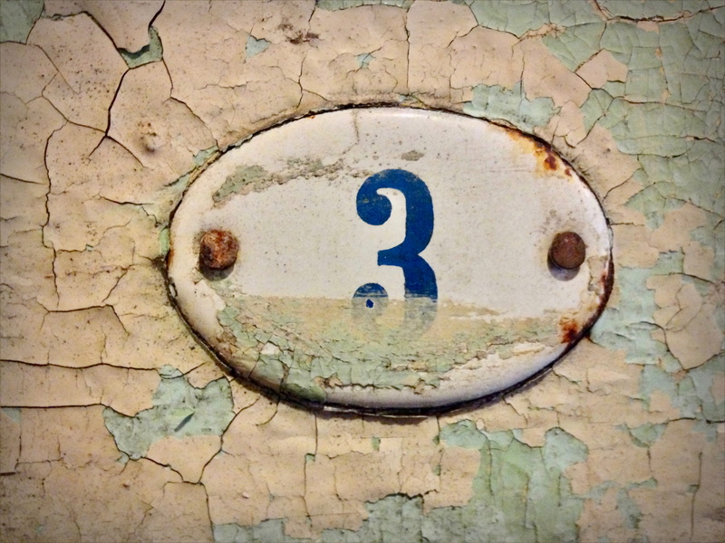 day, outdoors, metal, architecture, rough, communication, sing, circle, oval, shape, built structure, plaque, textured, rusty, wall, number, wall - building feature