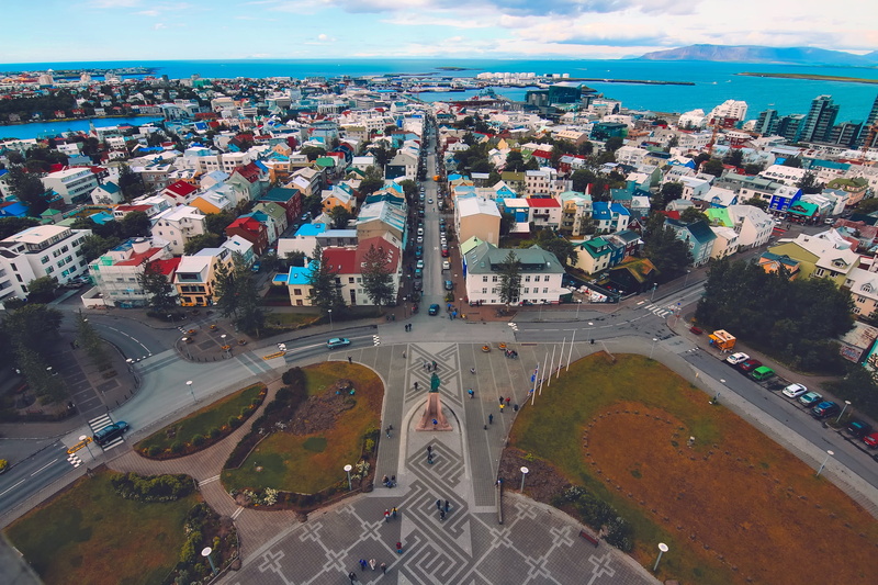 day, crowd, reykjavik, city, urban, blue, building, office building exterior, view, road, architecture, crowded, street, skyscraper, buildings, scenic