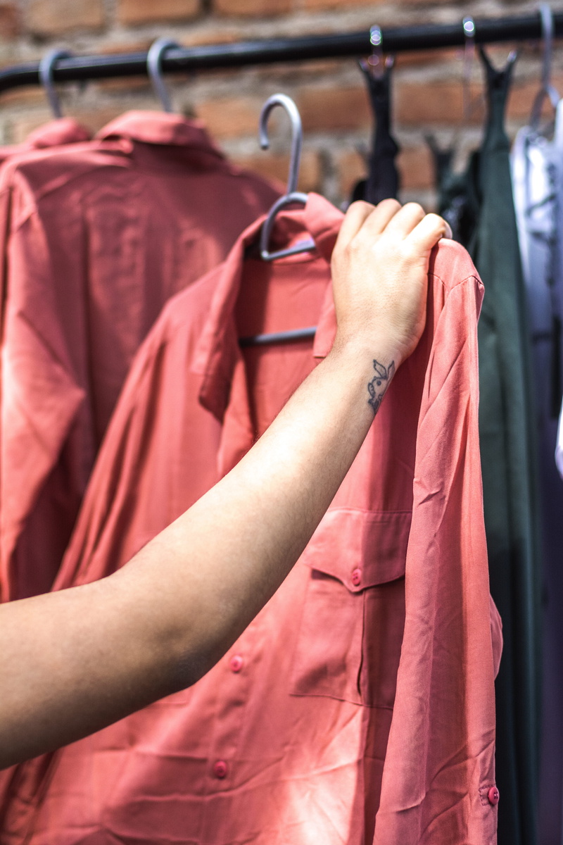 store, hand, people, wardrobe, hanging, clothes, coathanger, stock, 5K, hanger, clothes rack, focus on foreground, close-up, clothes line, boutique, rack