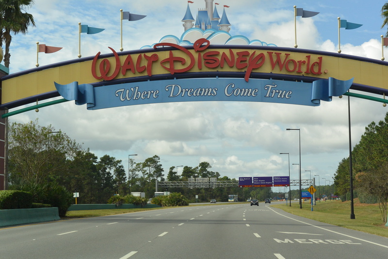 input, route, holiday, sign, disney, communication, travel, amusement, western script, transportation, arrival, road, world, mode of transportation, guidance