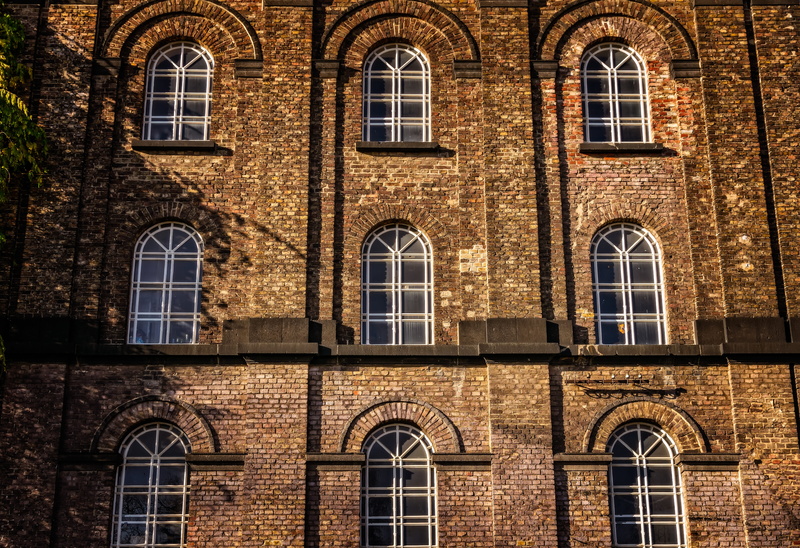 5K, side by side, atmosphere, day, factory, building, architecture, mood, outdoors, abandoned places, pattern, building exterior, brick wall, built structure