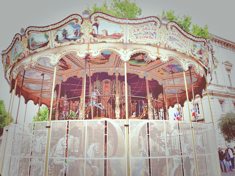 leisure activity, yellow, carousel, red, travel destinations, ornate, building exterior, arch, france, low angle view, architecture, railing, nature, red horse