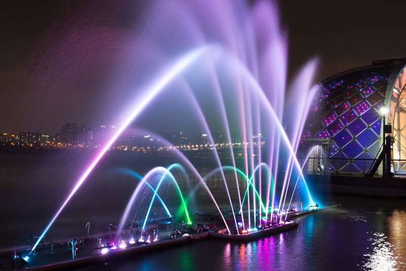 bridge - man made structure, arts culture and entertainment, glowing, no people, lake, illuminated, travel, famous Place, laser, long exposure, water, assorted