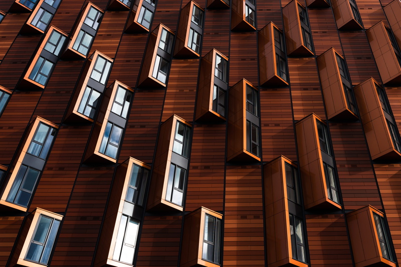 in a row, sunlight, building exterior, backgrounds, day, wall, low angle view, shapes, abstract, full frame, building, no people, modern, business, built structure