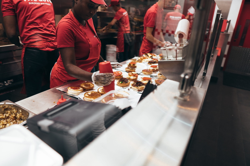 restaurant, person, five guys, food and drink, germany, preparing food, bar counter, dish, food, human, munich, 5K, food court, unhealthy eating, indoors