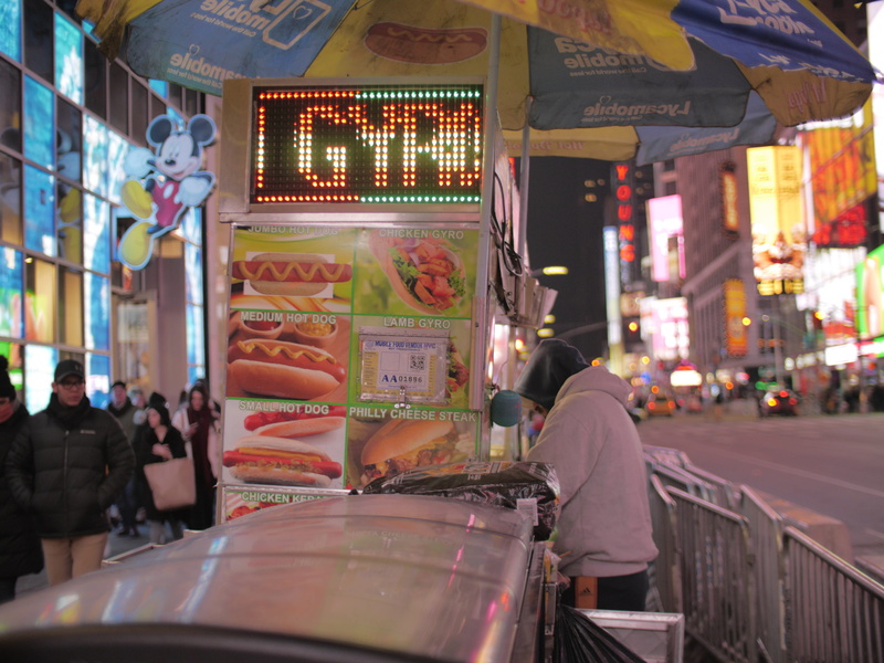 leisure activity, mode of transportation, women, diner, food, deli, men, city, cafeteria, arcade game machine, restaurant, vehicle, kiosk, city life, shop
