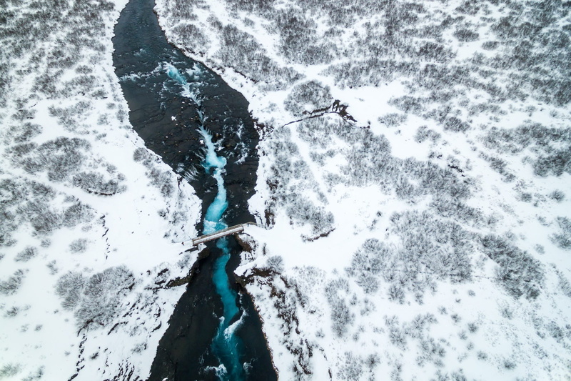 beauty in nature, tranquility, covering, no people, trees, cold temperature, snow, bridge, motion, land, river, flowing water, drone, day, water, aerial view
