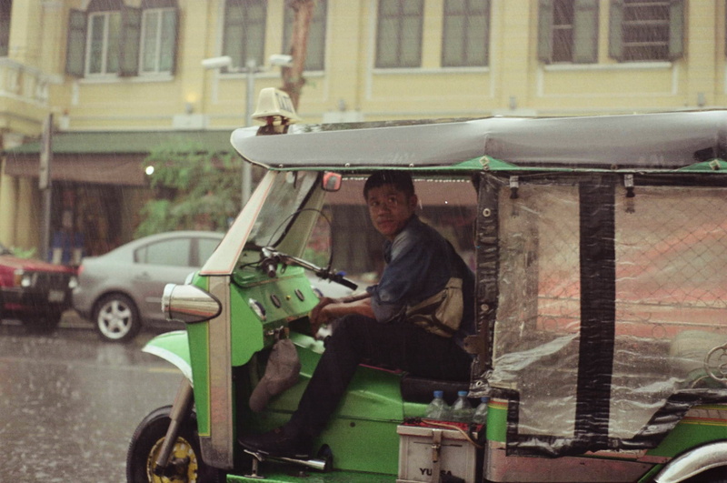 looking at camera, bangkok, taxi, people, holding, building exterior, real people, motor vehicle, mode of transportation, men, tuk tuk, outdoors, occupation
