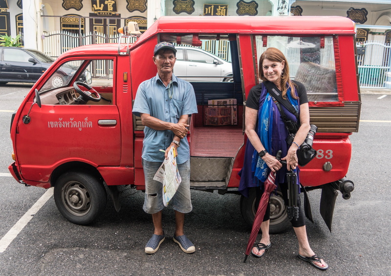 red, front view, casual clothing, city, two people, male, driver, outdoors, Person, adult, mature men, looking at camera, Phuket, land vehicle, happy, female