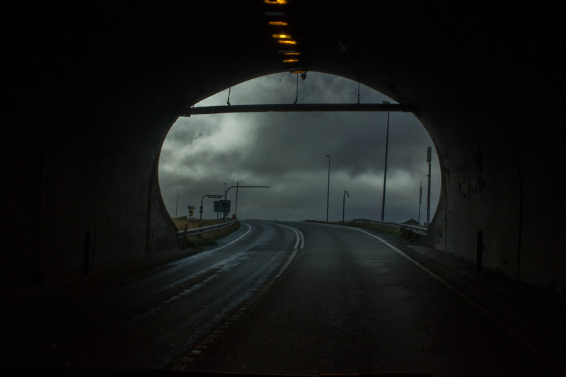 sky, arch, direction, the way forward, outdoors, street, fog, nature, diminishing perspective, streetlamp, sign, tunnel, ominous, highway, architecture