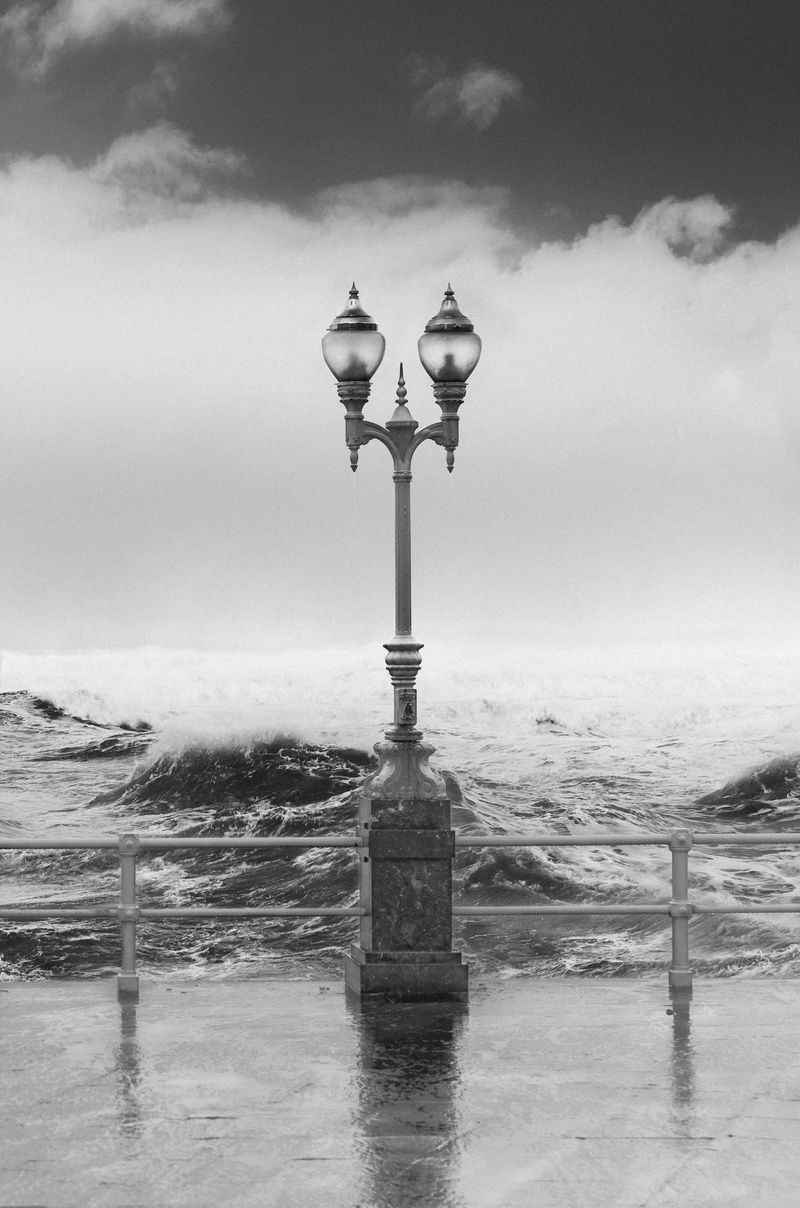 architecture, grayscale, cold temperature, wafe, photo, lantern, storm, seashore, ocean, rain, streetlamp, outdoor, waterfront, black and white