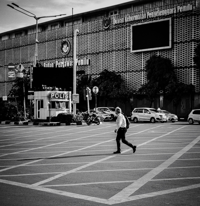 hut, men, sign, grid, streetlamp, vehicle, road, backpack, car, transportation, male, city, full length, person, 4K, lifestyles, real people, pedestrian