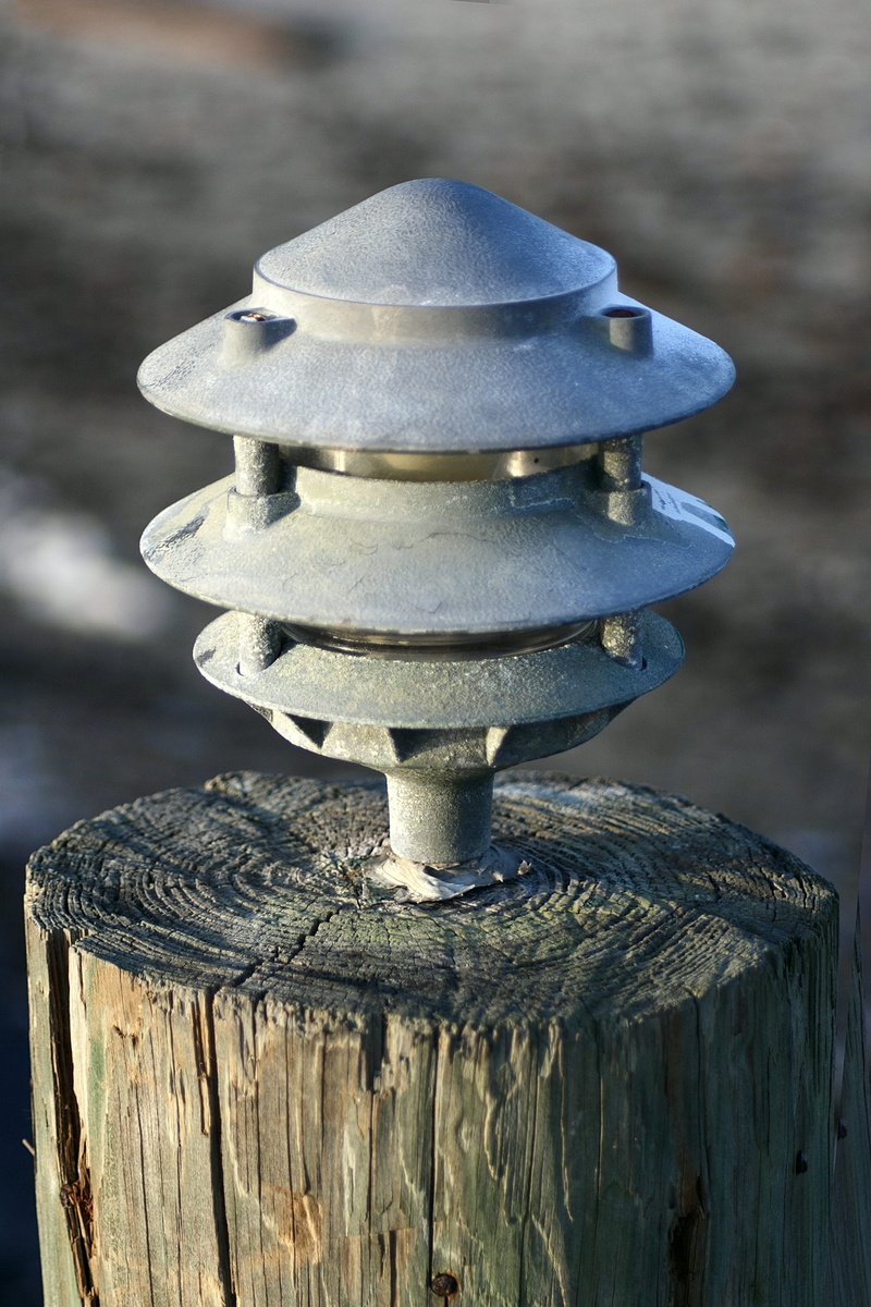 lamp, electrical, security, silver colored, beach light, metal, close-up, lamppost, sunlight, equipment, bolt, light, lighted, nut - fastener, wood - material