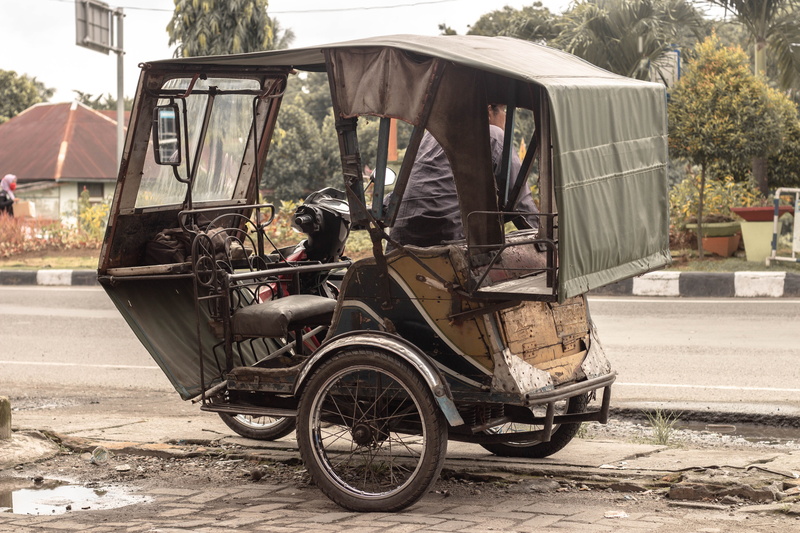 indonesia, built structure, building exterior, no people, road, traffic, motor vehicle, day, sunlight, plant, architecture, outdoors, tree, city, transportation